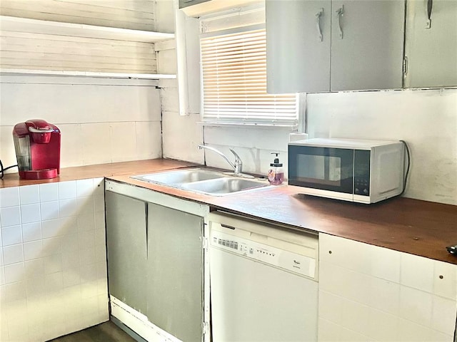 kitchen with sink and white dishwasher