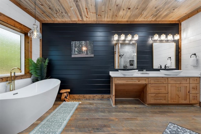 bathroom with a tub, wood walls, and wooden ceiling