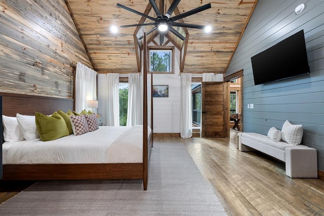 bedroom featuring ceiling fan, high vaulted ceiling, wood walls, wood ceiling, and hardwood / wood-style flooring