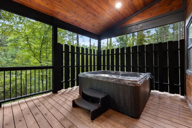 wooden terrace with a hot tub