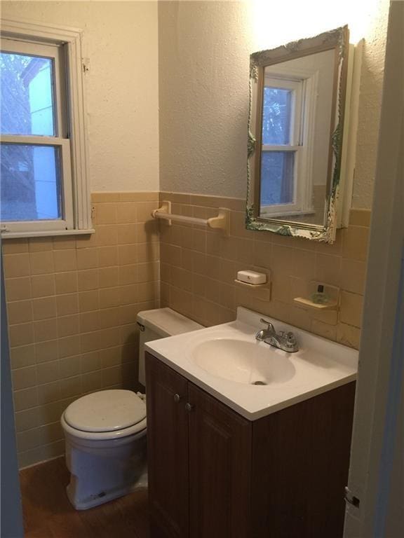 4108 SE 10th St, Del City, OK 73115 - bathroom with tile walls, vanity, and wainscoting
