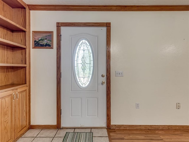 8015 County St Unit 2610, Hinton, OK 73047 - entrance foyer featuring ornamental molding and light tile patterned floors
