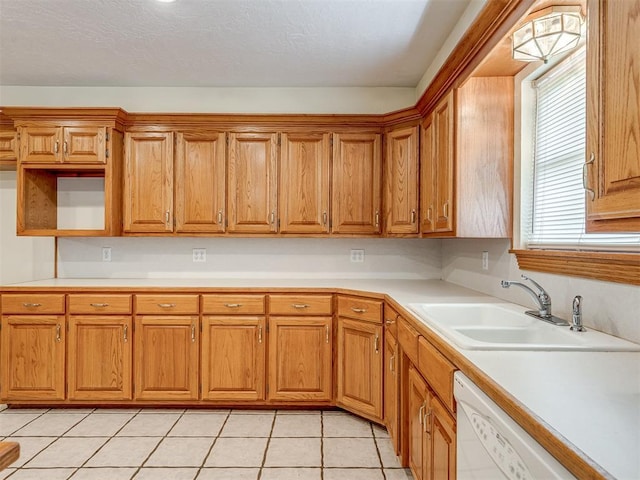 8015 County St Unit 2610, Hinton, OK 73047 - kitchen with dishwasher, light tile patterned floors, light countertops, and brown cabinets