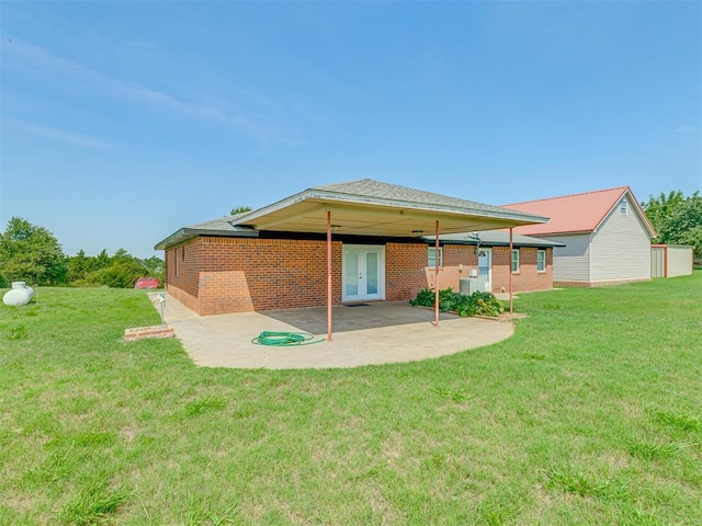 8015 County St Unit 2610, Hinton, OK 73047 - back of property featuring a patio, a lawn, french doors, and brick siding
