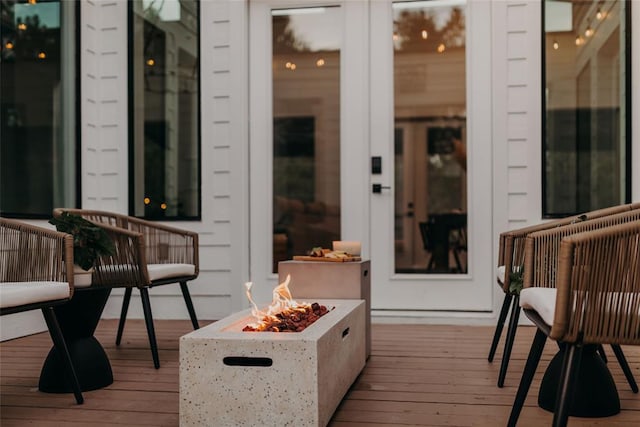 wooden deck featuring a fire pit