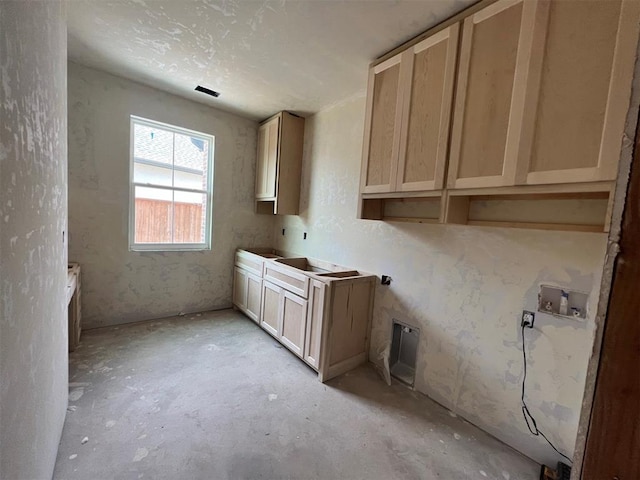 kitchen featuring light brown cabinetry