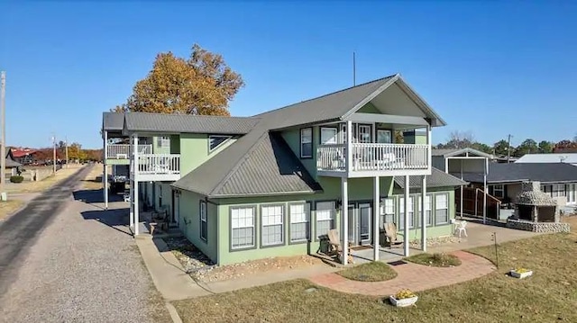 back of property with a balcony