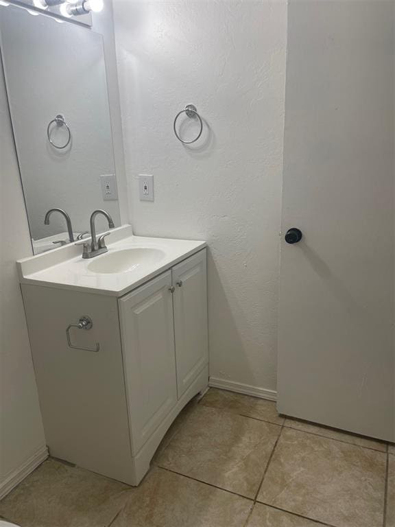 bathroom with vanity and tile patterned floors