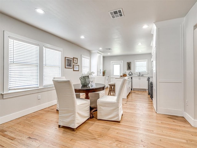 dining room featuring light wood-type flooring