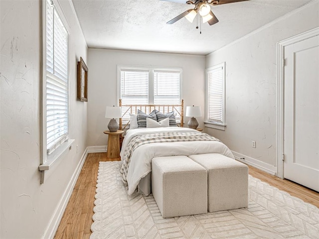 bedroom featuring ceiling fan and light hardwood / wood-style floors