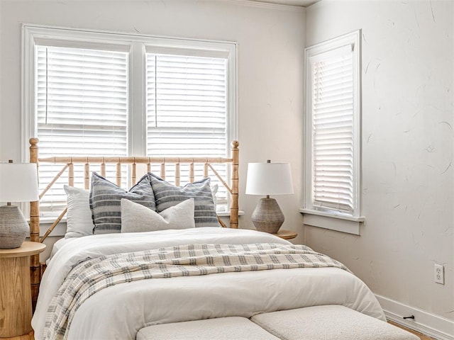 bedroom featuring multiple windows