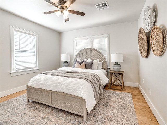 bedroom featuring hardwood / wood-style flooring and ceiling fan