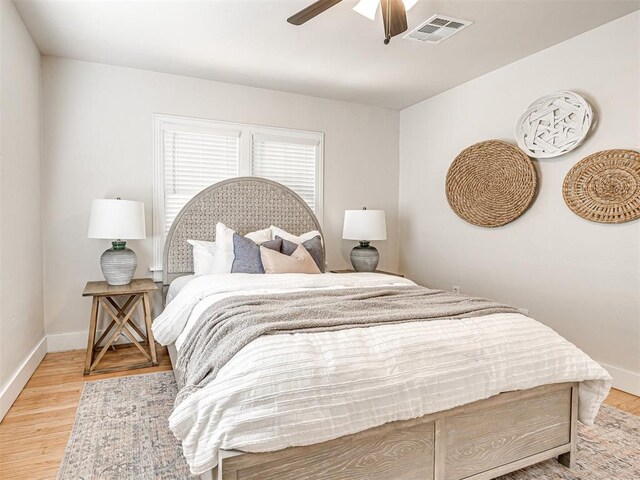 bedroom featuring ceiling fan and light hardwood / wood-style floors