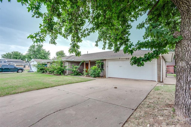 ranch-style house featuring a front yard and a garage