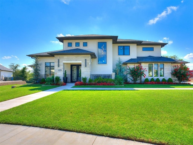 prairie-style house featuring a front lawn