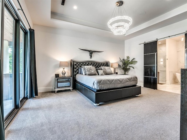 bedroom with light carpet, access to exterior, a tray ceiling, a barn door, and a chandelier