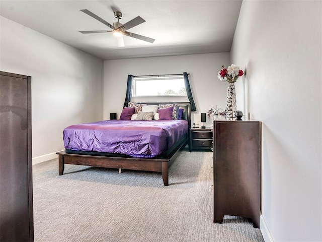 bedroom with light carpet and ceiling fan