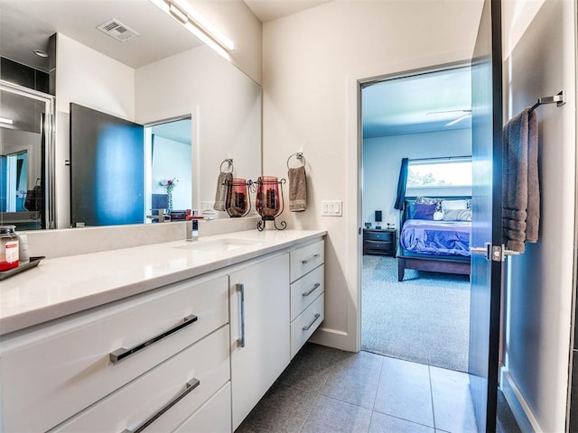 bathroom with tile patterned flooring and vanity