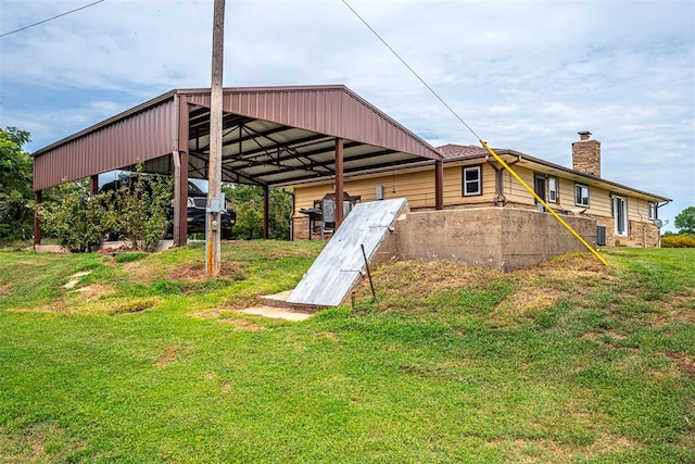 entry to storm shelter featuring a lawn