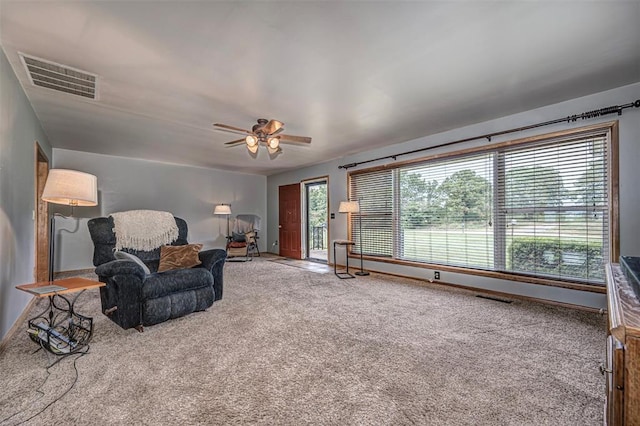 sitting room featuring carpet flooring and ceiling fan