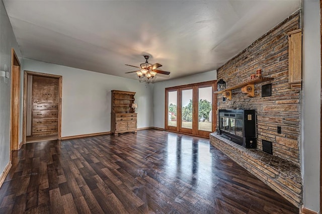 unfurnished living room with ceiling fan, dark hardwood / wood-style flooring, and a fireplace