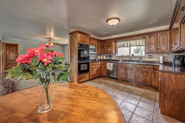 kitchen featuring ceiling fan, sink, stainless steel appliances, and tasteful backsplash