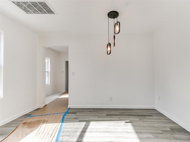 spare room featuring hardwood / wood-style floors