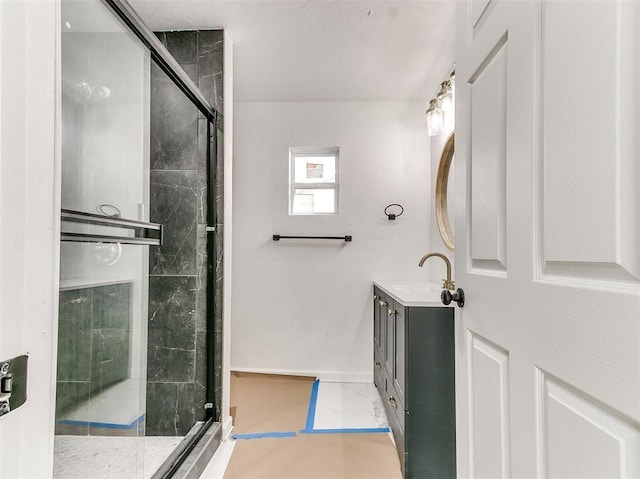 bathroom with vanity and an enclosed shower