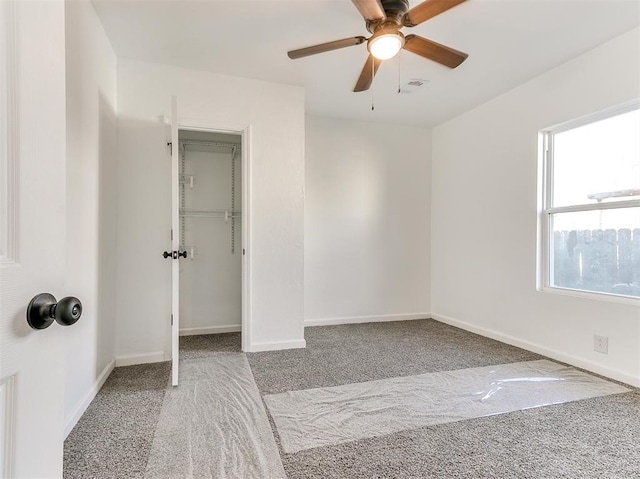 carpeted empty room with ceiling fan