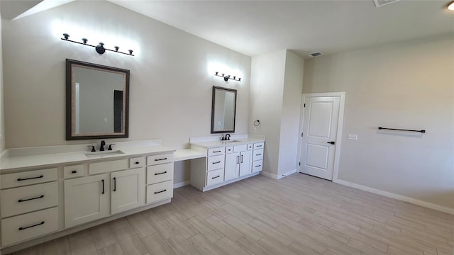 bathroom featuring wood-type flooring and vanity