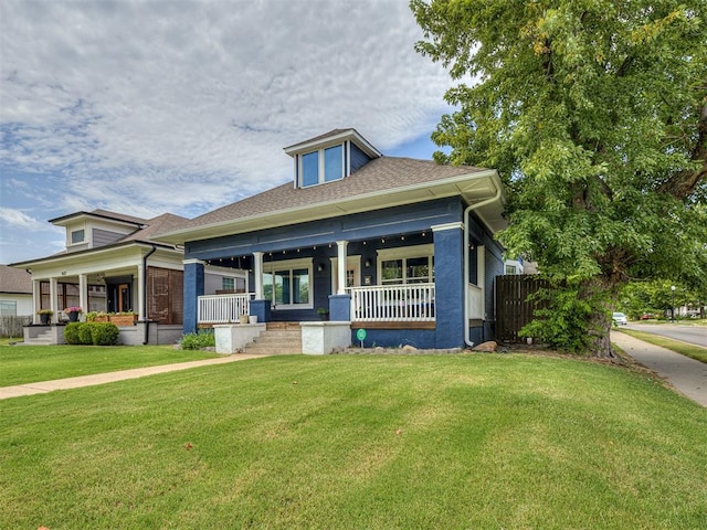 view of front of property featuring a porch and a front yard