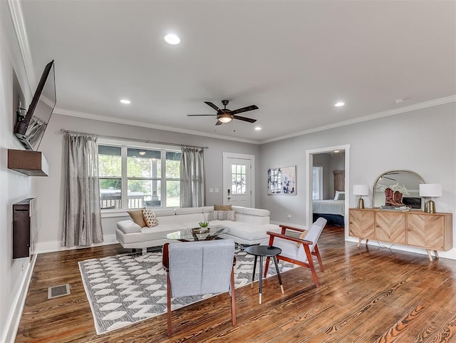 living room featuring crown molding, ceiling fan, and hardwood / wood-style flooring