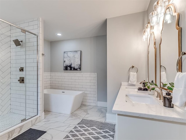 bathroom with vanity and separate shower and tub