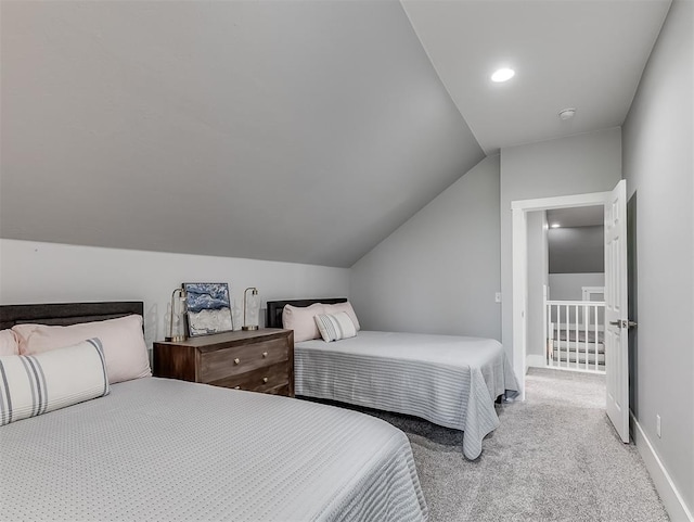 carpeted bedroom featuring lofted ceiling