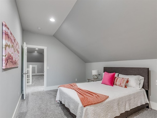 bedroom with carpet and lofted ceiling