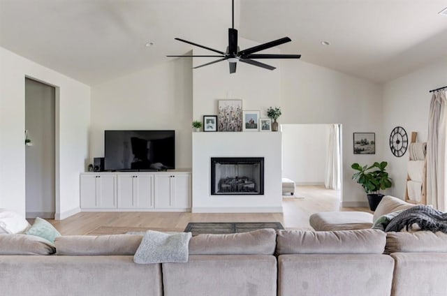 living room with high vaulted ceiling, light hardwood / wood-style flooring, and ceiling fan