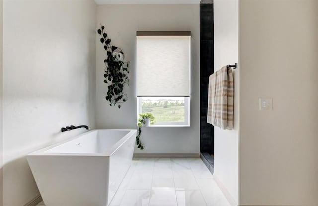 bathroom featuring tile patterned floors and plus walk in shower