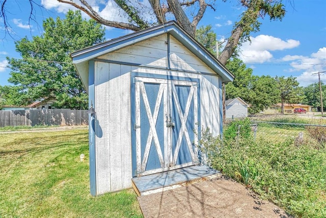 view of outdoor structure with a yard