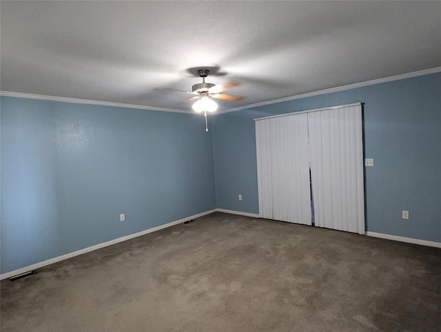 unfurnished bedroom featuring carpet floors, ceiling fan, and crown molding