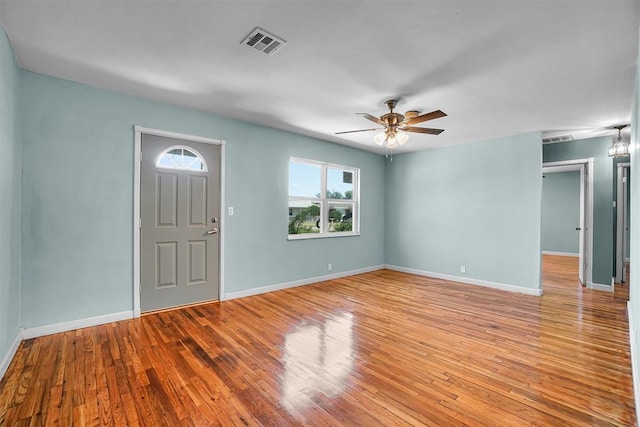 1033 Coe St, Altus, OK 73521 - empty room with baseboards, a ceiling fan, and wood finished floors