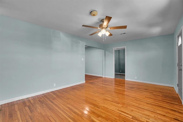 1033 Coe St, Altus, OK 73521 - unfurnished room featuring ceiling fan, baseboards, light wood-type flooring, and a smoke detector