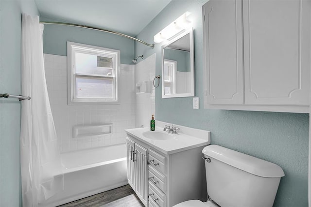 1033 Coe St, Altus, OK 73521 - bathroom with shower / tub combo with curtain, toilet, vanity, and wood finished floors