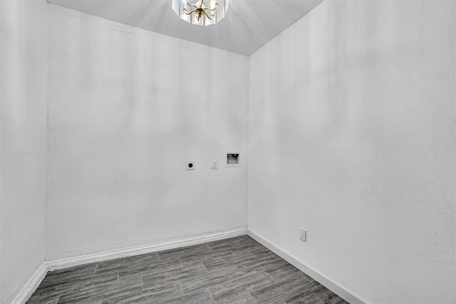 1033 Coe St, Altus, OK 73521 - laundry room with electric dryer hookup, hookup for a washing machine, baseboards, and a chandelier