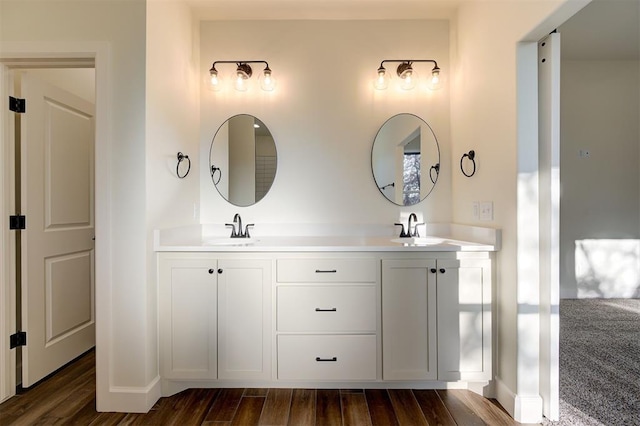 bathroom featuring hardwood / wood-style floors and vanity