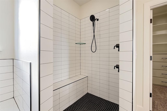 bathroom with tiled shower