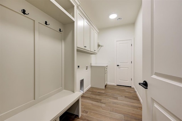 mudroom with light hardwood / wood-style flooring