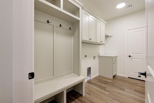 mudroom with light hardwood / wood-style floors