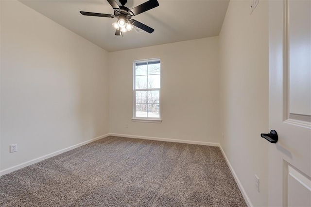 spare room featuring carpet and ceiling fan