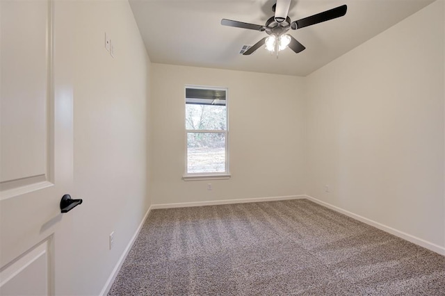 carpeted empty room featuring ceiling fan