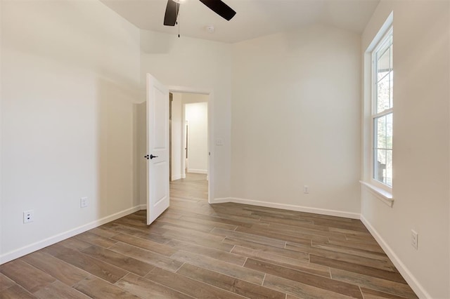 unfurnished room with hardwood / wood-style floors and ceiling fan